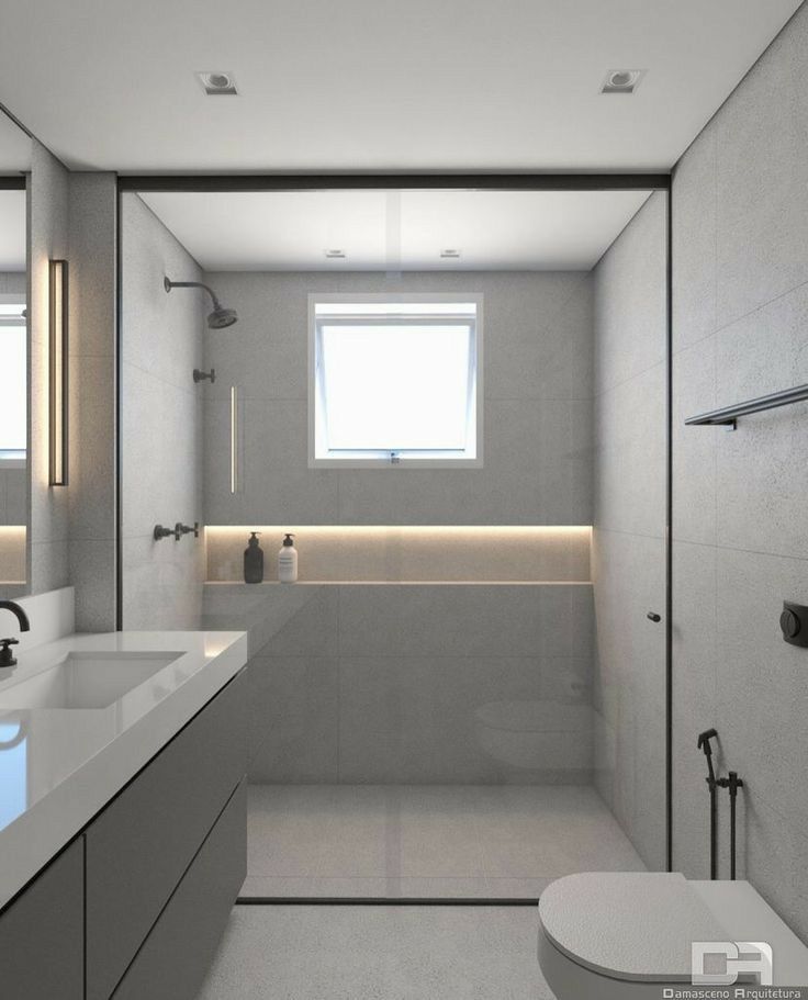 Baño moderno con ducha integrada y nicho iluminado